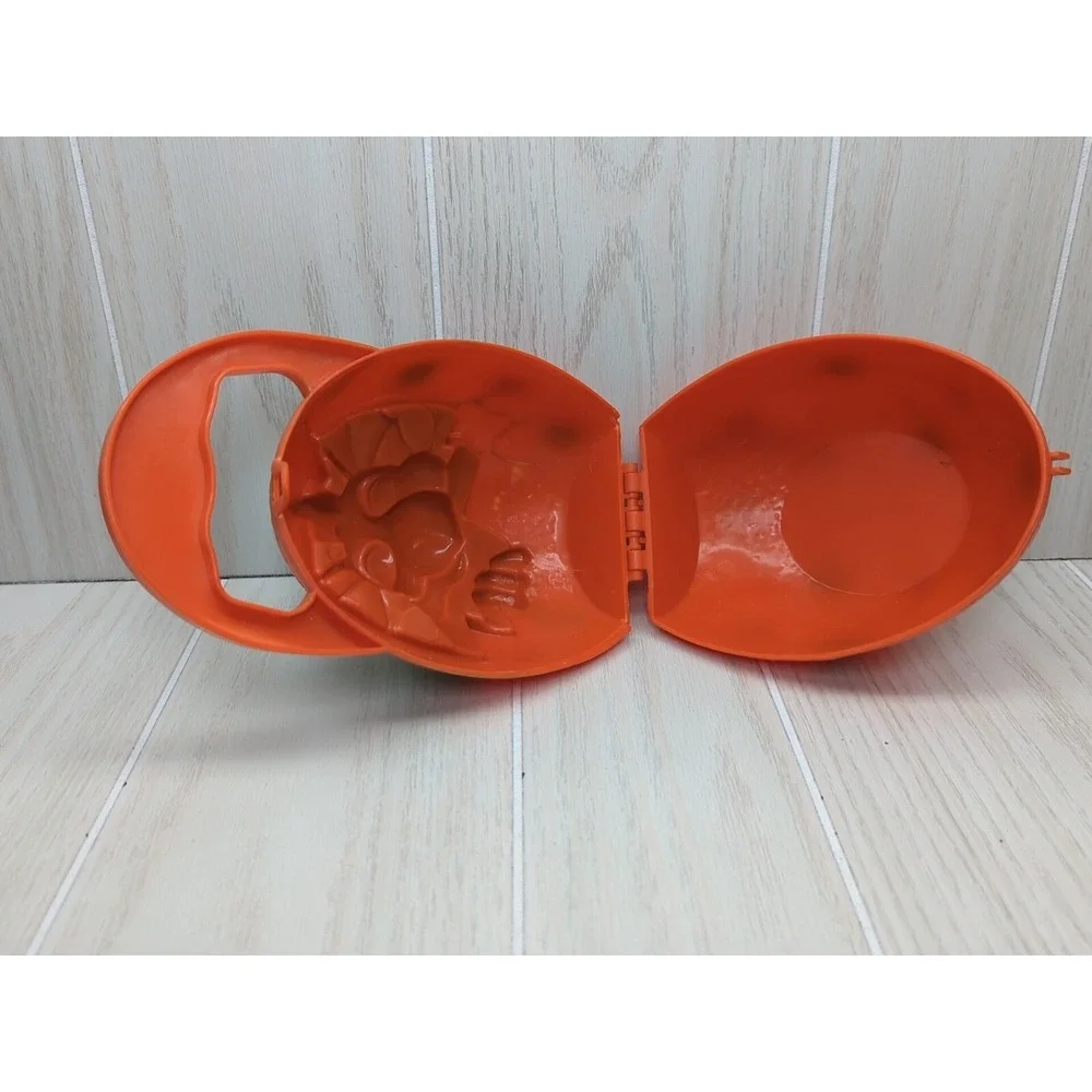 Busch Gardens Land of the Dragons orange egg carry case green baby dragon